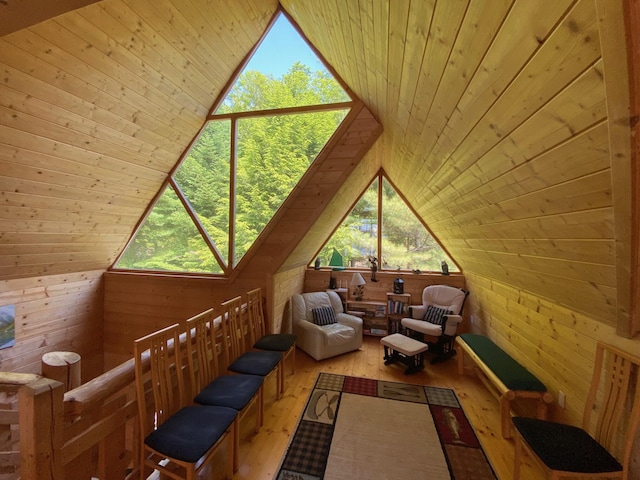 378 Black Point Rd, Beaver Cove, ME 04441 - living area featuring wood walls, hardwood / wood-style flooring, vaulted ceiling, and wooden ceiling