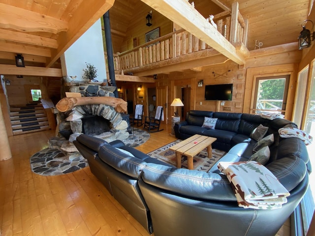 378 Black Point Rd, Beaver Cove, ME 04441 - living room with wooden ceiling, hardwood / wood-style floors, high vaulted ceiling, and wooden walls