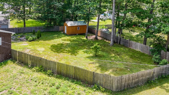 1 Chestnut Ave, Windham, ME 04062 - fenced backyard featuring a storage shed