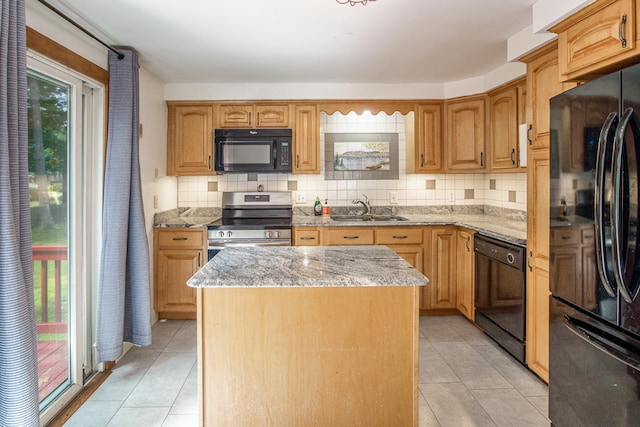 1 Chestnut Ave, Windham, ME 04062 - kitchen with black appliances, a kitchen island, backsplash, and light tile patterned floors
