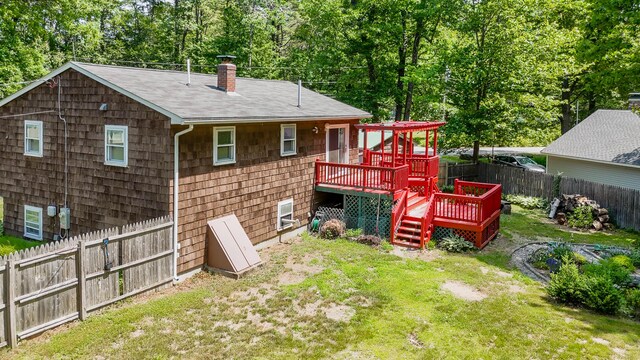 1 Chestnut Ave, Windham, ME 04062 - rear view of property with a deck, a chimney, a fenced backyard, roof with shingles, and view of scattered trees