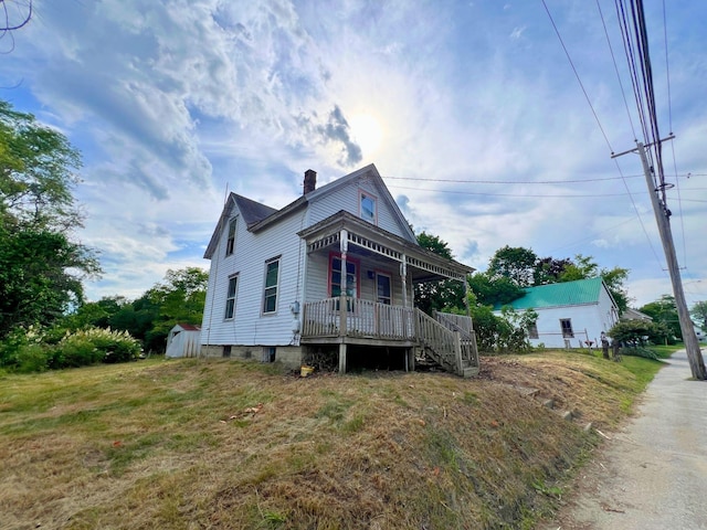 363 Lisbon St, Lisbon, ME 04250 - view of home's exterior with a porch, a chimney, and stairs