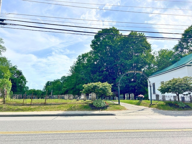 363 Lisbon St, Lisbon, ME 04250 - view of asphalt road featuring view of wooded area