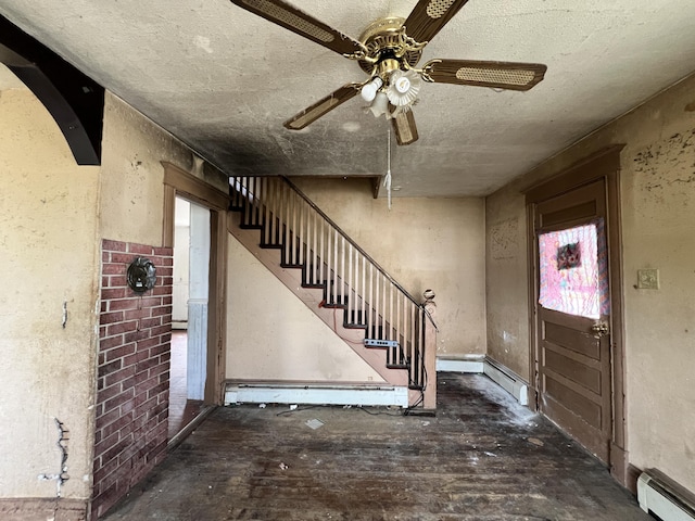 363 Lisbon St, Lisbon, ME 04250 - entrance foyer featuring a baseboard heating unit, a ceiling fan, baseboard heating, stairs, and a textured ceiling