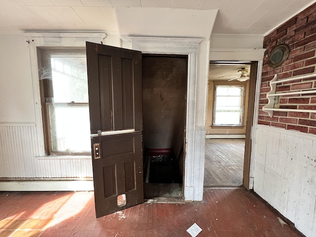 363 Lisbon St, Lisbon, ME 04250 - foyer featuring a wainscoted wall, wood-type flooring, crown molding, a baseboard heating unit, and ceiling fan