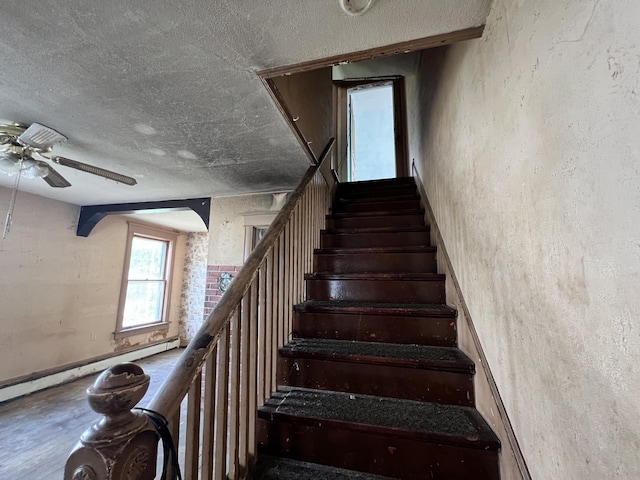 363 Lisbon St, Lisbon, ME 04250 - stairway featuring a textured ceiling and a ceiling fan