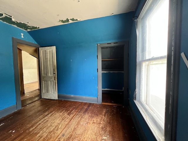 363 Lisbon St, Lisbon, ME 04250 - unfurnished bedroom with vaulted ceiling and wood finished floors