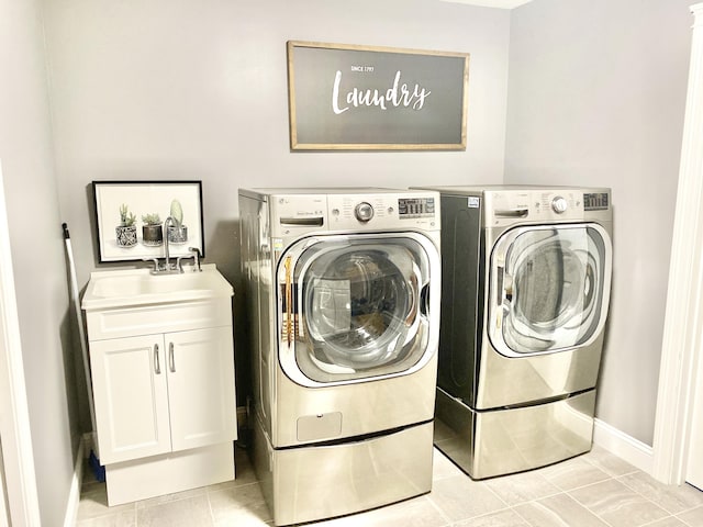 8 Clark Cir, Hampden, ME 04444 - laundry area with washer and clothes dryer, cabinet space, and light tile patterned floors