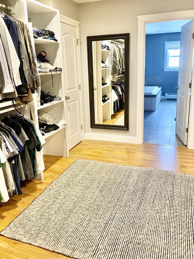 8 Clark Cir, Hampden, ME 04444 - hall featuring wood finished floors and a baseboard heating unit