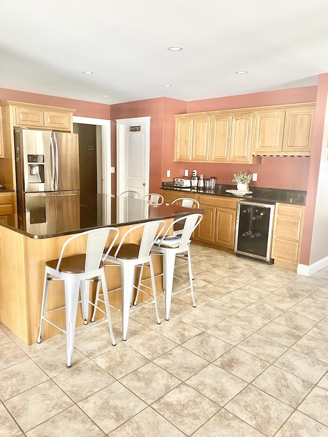 8 Clark Cir, Hampden, ME 04444 - kitchen featuring stainless steel fridge with ice dispenser, wine cooler, dark countertops, a kitchen breakfast bar, and recessed lighting