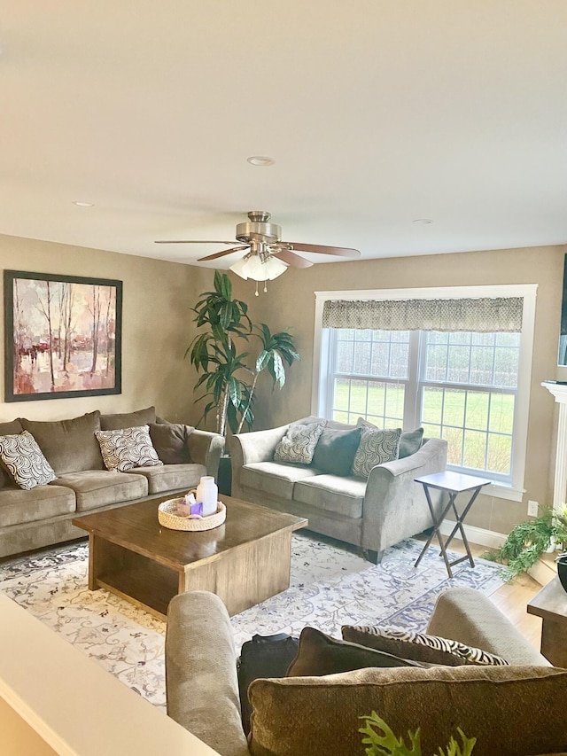 8 Clark Cir, Hampden, ME 04444 - living area with a ceiling fan and wood finished floors