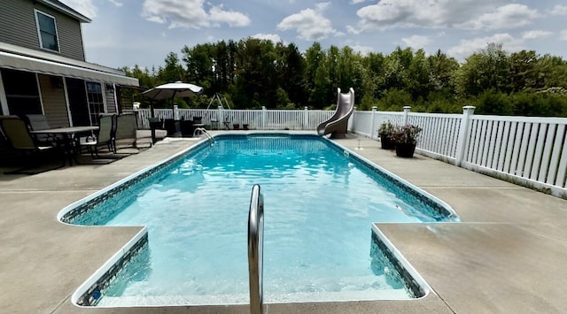 8 Clark Cir, Hampden, ME 04444 - view of swimming pool featuring a water slide, a fenced backyard, and a patio area