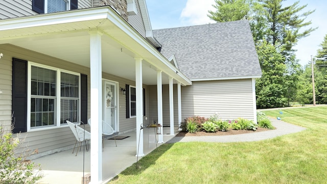 8 Clark Cir, Hampden, ME 04444 - entrance to property with a shingled roof, a lawn, and covered porch