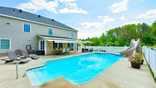 8 Clark Cir, Hampden, ME 04444 - view of swimming pool featuring a patio, a water slide, and a fenced backyard
