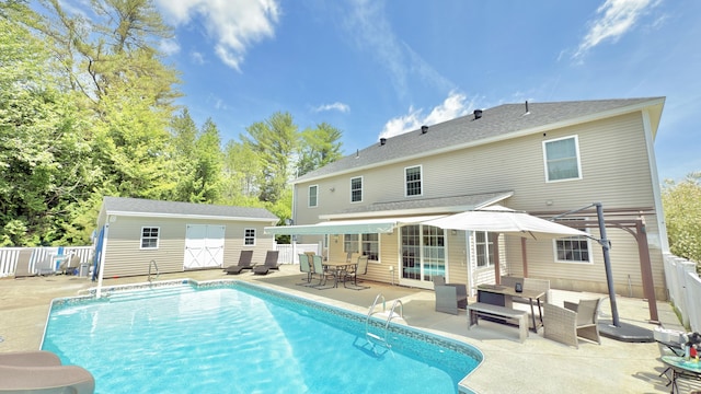 8 Clark Cir, Hampden, ME 04444 - rear view of property featuring a patio area, outdoor lounge area, a storage shed, and outdoor dining area