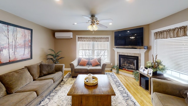 8 Clark Cir, Hampden, ME 04444 - living area featuring an AC wall unit, a ceiling fan, a tile fireplace, plenty of natural light, and recessed lighting