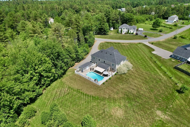 8 Clark Cir, Hampden, ME 04444 - aerial view of property and surrounding area featuring a heavily wooded area and a pool area