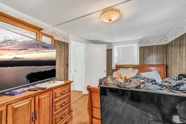 350 Cushing Rd, Cushing, ME 04563 - bedroom featuring light wood-style flooring, wood walls, and wallpapered walls