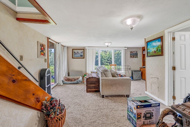 350 Cushing Rd, Cushing, ME 04563 - living room with carpet floors and wallpapered walls