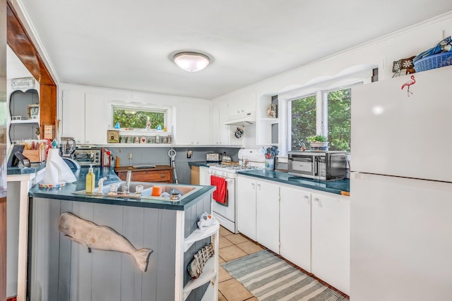 350 Cushing Rd, Cushing, ME 04563 - kitchen with white appliances, open shelves, and healthy amount of natural light