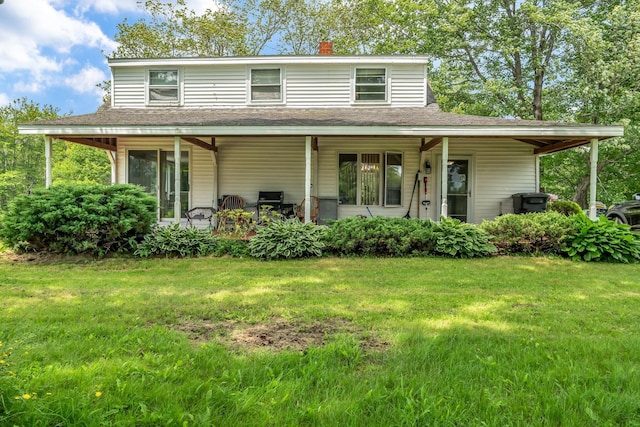 350 Cushing Rd, Cushing, ME 04563 - farmhouse featuring a front lawn, a porch, a chimney, and a shingled roof