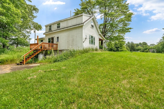 350 Cushing Rd, Cushing, ME 04563 - rear view of house featuring stairway, a deck, and a lawn