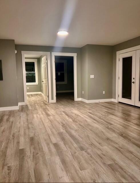 42 Applehead Way, Orrington, ME 04474 - unfurnished living room featuring light wood-style flooring and baseboards