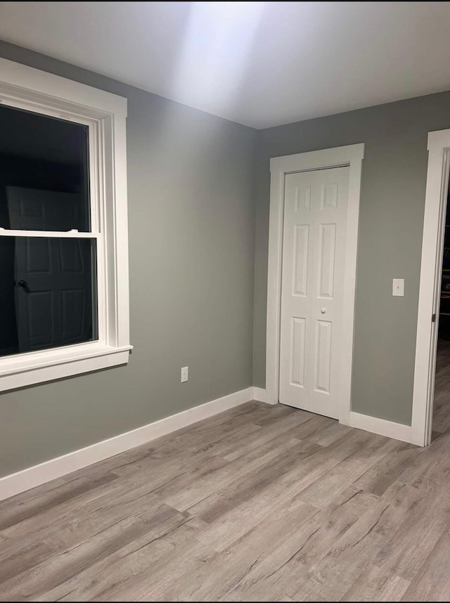 42 Applehead Way, Orrington, ME 04474 - unfurnished bedroom featuring light wood-style flooring and baseboards