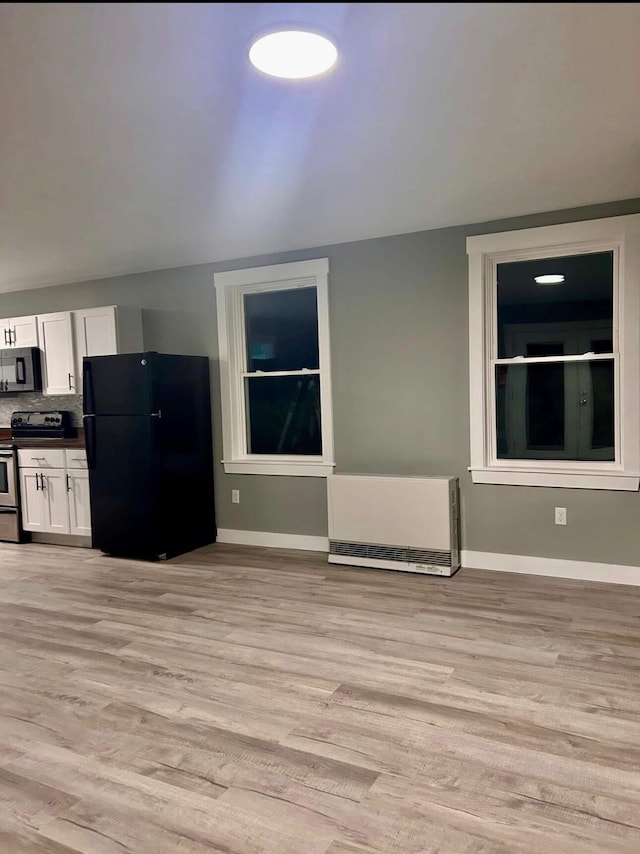 42 Applehead Way, Orrington, ME 04474 - kitchen with black appliances, white cabinets, light wood-type flooring, and dark countertops