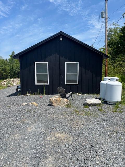42 Applehead Way, Orrington, ME 04474 - view of side of property featuring board and batten siding