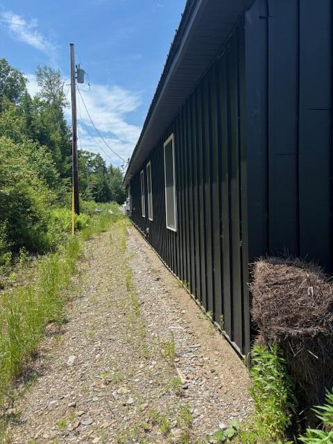 42 Applehead Way, Orrington, ME 04474 - view of side of home featuring board and batten siding