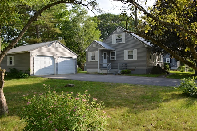 251 E Bridge St, Westbrook, ME 04092 - view of front of property featuring an outdoor structure, a garage, and a front lawn