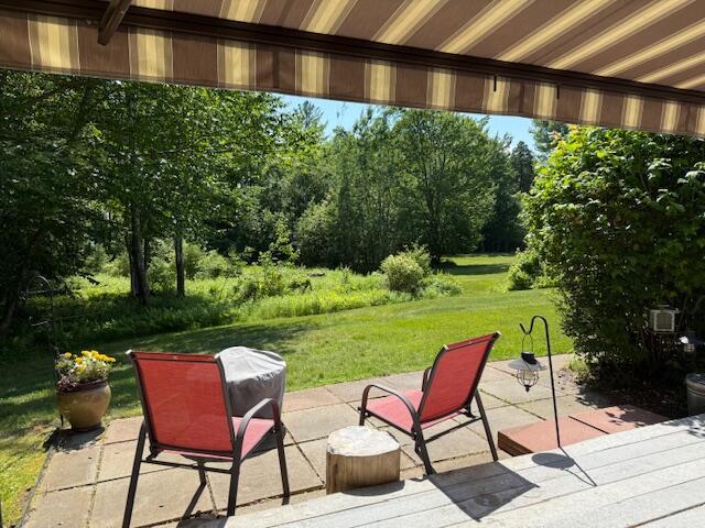 12 Doe Ct Unit 12, Naples, ME 04055 - view of patio featuring view of wooded area