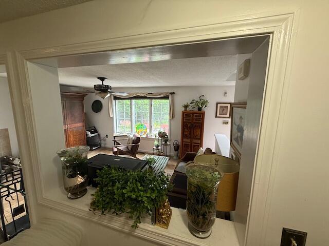 12 Doe Ct Unit 12, Naples, ME 04055 - living room featuring a desk and ceiling fan