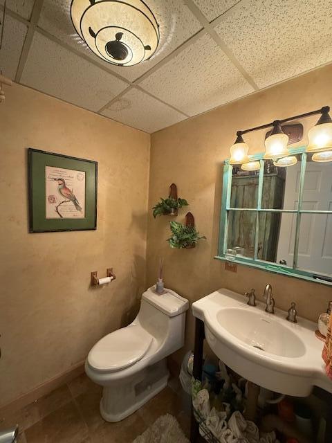 12 Doe Ct Unit 12, Naples, ME 04055 - bathroom with a paneled ceiling and tile patterned floors