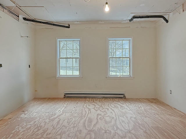 35 Washington St, Rumford, ME 04276 - spare room featuring baseboard heating and plenty of natural light