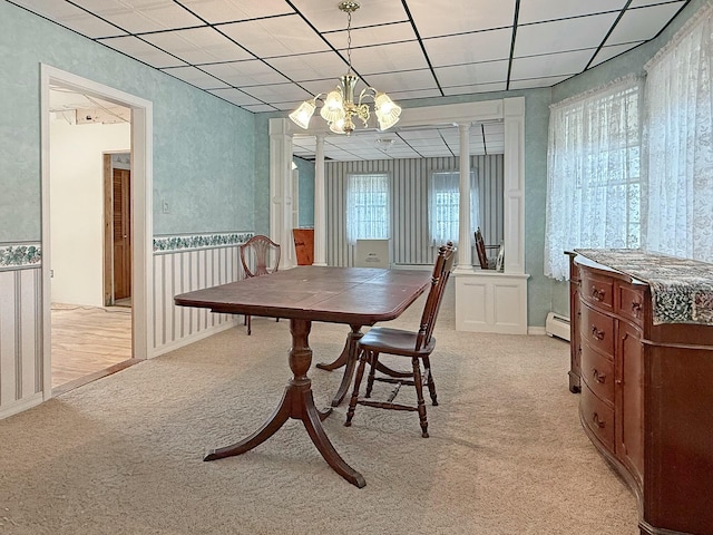 35 Washington St, Rumford, ME 04276 - dining space featuring light colored carpet, a chandelier, a baseboard radiator, and a drop ceiling