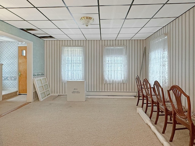 35 Washington St, Rumford, ME 04276 - carpeted dining area featuring wallpapered walls, a baseboard radiator, and a paneled ceiling