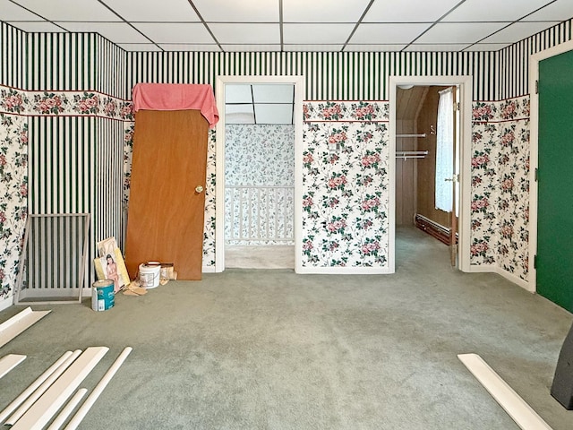 35 Washington St, Rumford, ME 04276 - carpeted empty room featuring wallpapered walls and a drop ceiling