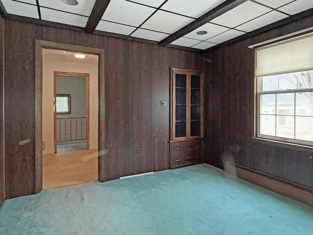 35 Washington St, Rumford, ME 04276 - spare room with carpet, plenty of natural light, and wood walls