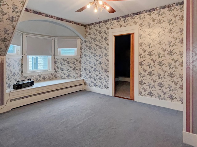 35 Washington St, Rumford, ME 04276 - unfurnished bedroom featuring a baseboard radiator, wallpapered walls, carpet floors, and ceiling fan