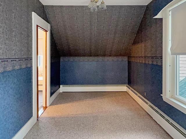 35 Washington St, Rumford, ME 04276 - additional living space with a baseboard heating unit, carpet, and lofted ceiling