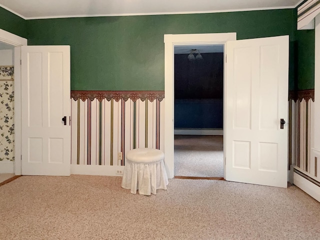 35 Washington St, Rumford, ME 04276 - unfurnished bedroom featuring baseboard heating, carpet floors, a baseboard radiator, and crown molding
