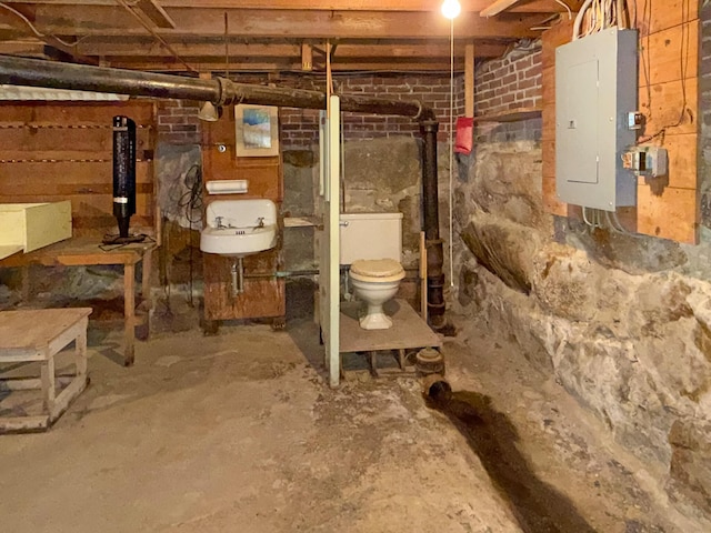 35 Washington St, Rumford, ME 04276 - unfinished below grade area with electric panel and a sink
