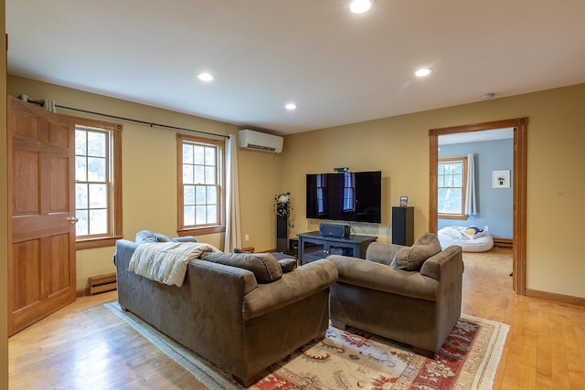 270 Park St, Rockport, ME 04856 - living area featuring an AC wall unit, recessed lighting, light wood finished floors, and a baseboard heating unit