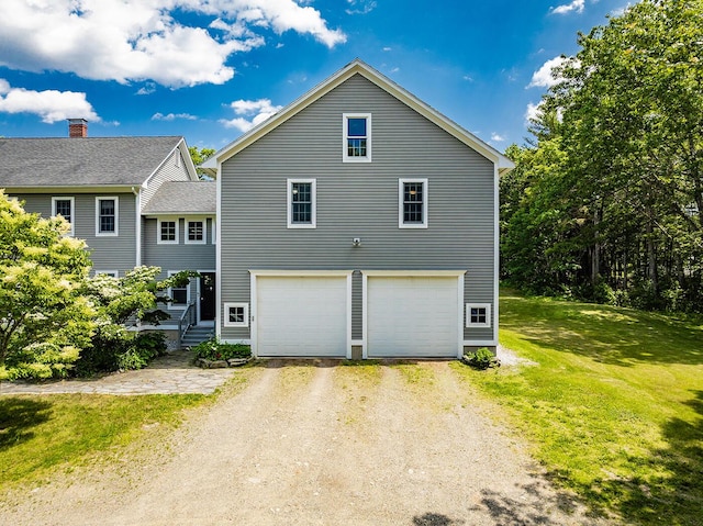 270 Park St, Rockport, ME 04856 - view of side of home featuring driveway, a yard, and a garage
