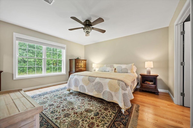 7 Coastal Woods Dr Unit 102, Kennebunk, ME 04043 - bedroom with light wood finished floors and a ceiling fan