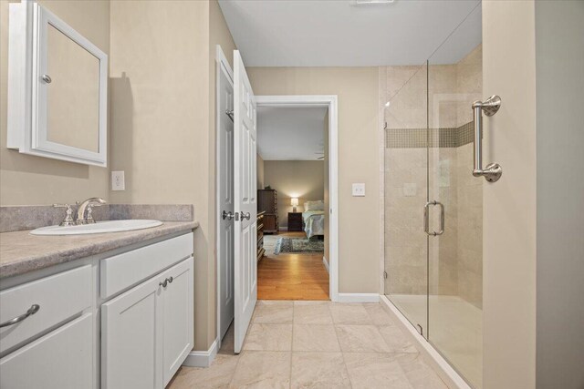 7 Coastal Woods Dr Unit 102, Kennebunk, ME 04043 - ensuite bathroom featuring a stall shower and vanity