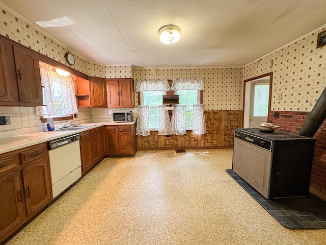 144 Main Rd, Burlington, ME 04417 - kitchen featuring dishwasher, plenty of natural light, light countertops, backsplash, and wallpapered walls