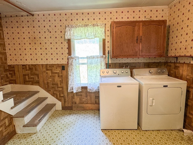 144 Main Rd, Burlington, ME 04417 - laundry area with washer and dryer, wallpapered walls, crown molding, and cabinet space